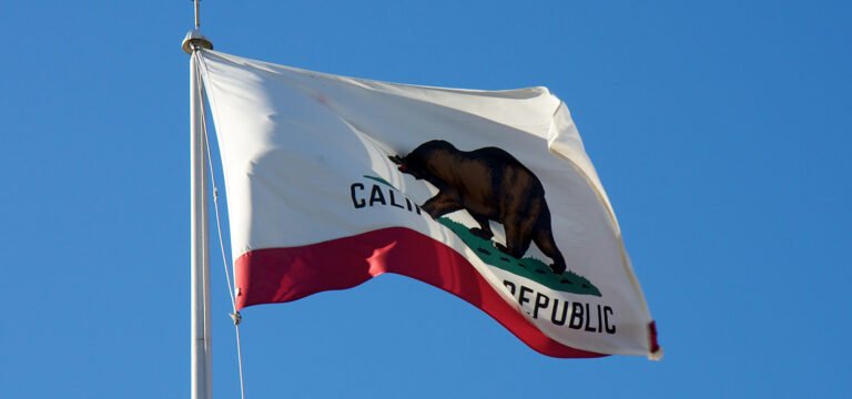 California Tightens Cannabis Advertising and Labeling Rules The state flag of California flying on a clear